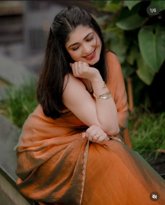 Golden shimmery party wear saree